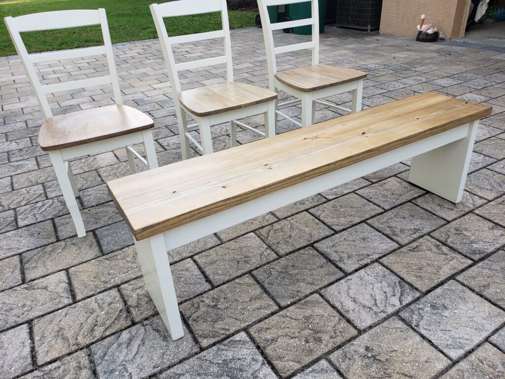 weathered oak bench and ladderback chairs with white frames